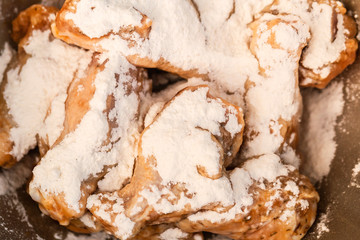 Close up of small wing chicken under flour for frying.