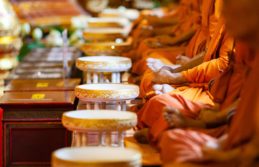 buddhist monks in a row