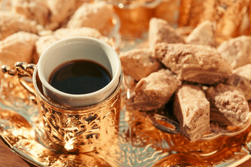 Turkish sweets with coffee on a wooden table