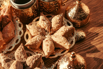 Turkish sweets with coffee on a wooden table