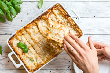 Homemade baked lasagna emiliane made from traditional meat ragù cooked for 4 hours, béchamel...