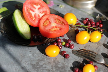 kerosene lamp, lemons and tomatoes, forks and knives