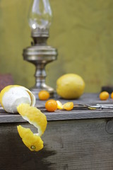 kerosene lamp, lemons and tomatoes, forks and knives