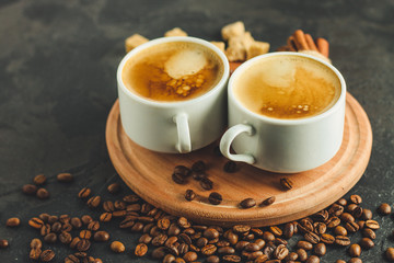 coffee fresh and hot in a white cup, aroma. serving of beverage (coffee grain). food. top view. copy space