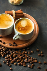 coffee fresh and hot in a white cup, aroma. serving of beverage (coffee grain). food. top view. copy space