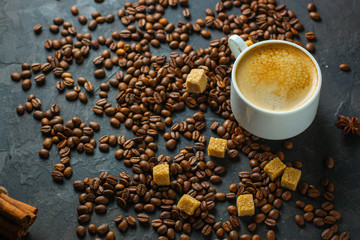 coffee fresh and hot in a white cup, aroma. serving of beverage (coffee grain). food. top view. copy space