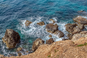 Sea stones rocks washed by sea waves near Tuffieha, Mgarr, Malta