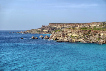 Fototapeta na wymiar View of a Golden Bay in Ghajn Tuffieha, Mgarr, Malta