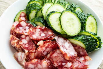 Chopped cucumber slices and sausage