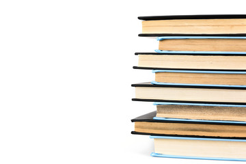 Stack of black and blue books isolated on white