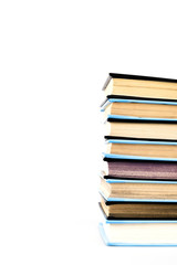 Stack of black and blue books isolated on white
