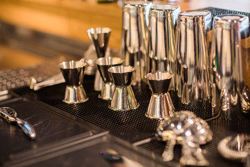 Stainless steel double-side cocktail jigger measure cup and shaker for making cocktails.