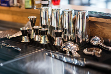 Stainless steel double-side cocktail jigger measure cup and shaker for making cocktails.
