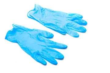 Two blue rubber gloves isolated on white surface