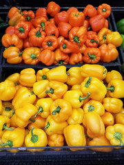 Orange and yellow bell peppers, natural background