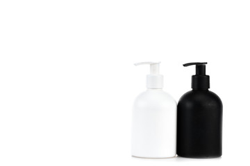 Black and white cosmetic spray bottles isolated on white