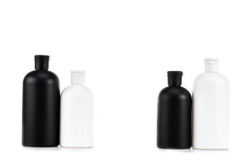 Black and white cosmetic bottles isolated on white