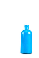 Blue cosmetic bottle with cap isolated on white