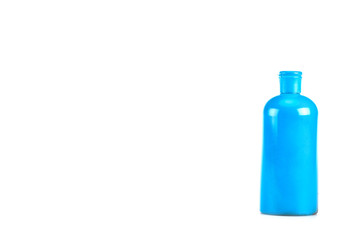 Blue cosmetic bottle with cap isolated on white