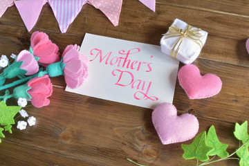 Mothers day with handwritten calligraphy and handmade flowers, hearts, flags, a gift. (28-1)