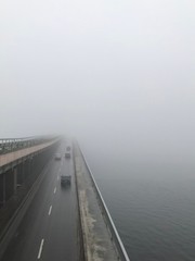 view on the bridge under the fog