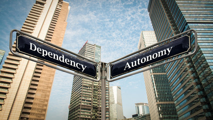 Fototapeta na wymiar Street Sign Autonomy versus Dependency