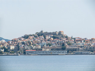 Fototapeta na wymiar Beautiful view from the sea to the city on the island and the ancient fortress