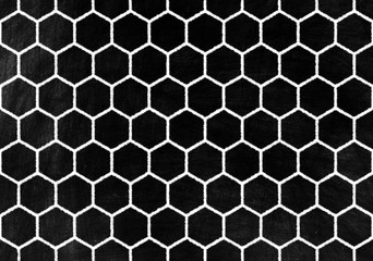 Honeycomb or Beehive Pattern on Old Grunge Chalkboard Background.