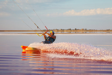 Kitesurfer smiles into the camera.