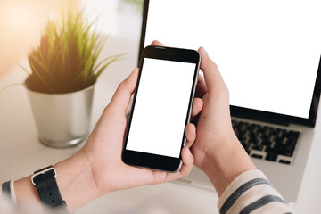 Close up Woman hand Using a Smart Phone with blank screen at home.