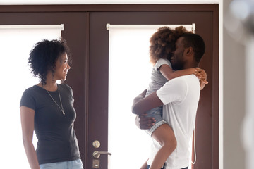 African American man returned after business trip, family reunion