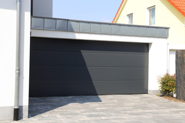 Modern new garage door (sectional door) - obrazy, fototapety, plakaty
