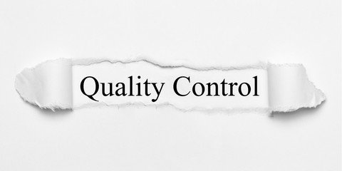 Quality Control on white torn paper