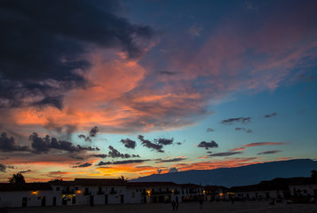 Multiple exposure of a beautiful sunset over the main square of  the colonial town of Villa de Leyva, in the Andean mountains of central Colombia.