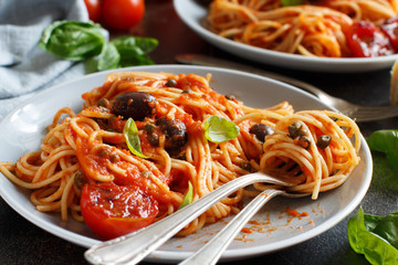 Spaghetti with tomato sauce olives and capers
