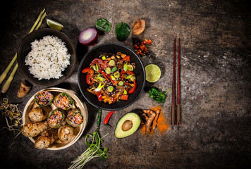 Asian food background with various ingredients on rustic stone background , top view.