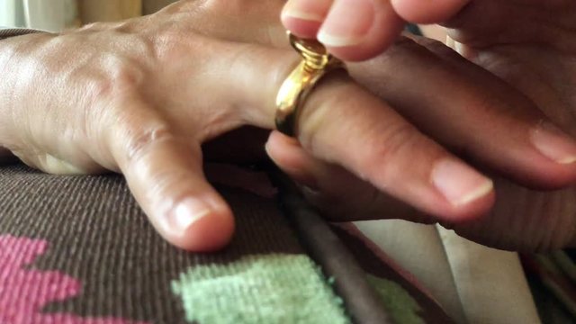 Woman Taking Off Her Diamond Ring.