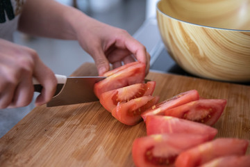 hands holding sharp knife and chopping