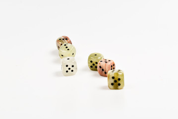 Dices made of natural stone on a white background. Copy space. Gaming.