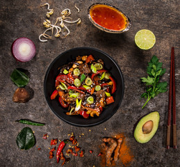 Szechuan beef asian food background with various ingredients on stone table.