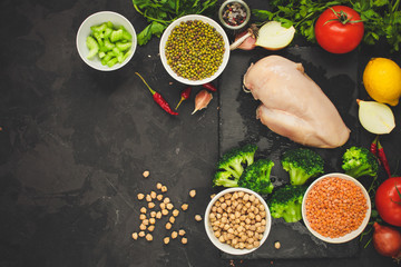 raw chicken meat, vegetables and legumes (lentils,  mung beans  and more) ingredients, healthy food. copy space. food background. top