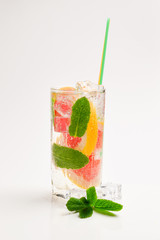 Summer detox drink with fresh fruits in glass jar.