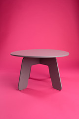 Children's gray table on a pink background