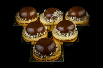 closeup french mini mousse pastry desserts served in triangle shape