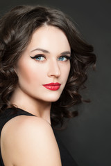 Cheerful model woman with makeup and curly hair portrait