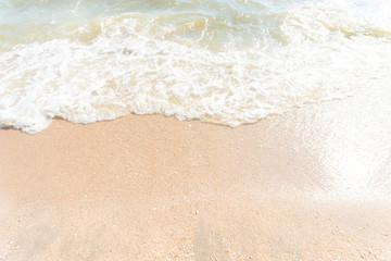Sea beach with sand. Water wavey