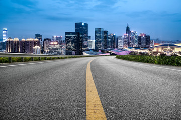 Road and skyline of urban architecture..