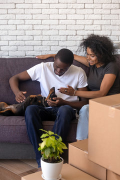 Happy African American Couple With Dog Just Moving In New House