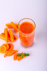 Fresh carrot juice. Carrot drink on a white background. Copy space.