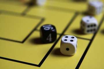 Close up of dices on yellow game board